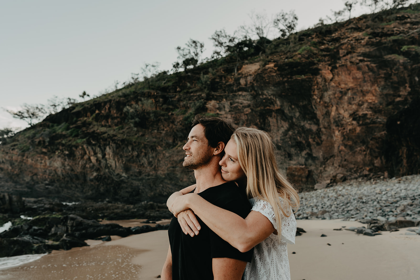 Couple getting engagement photos at Sunshine Beach